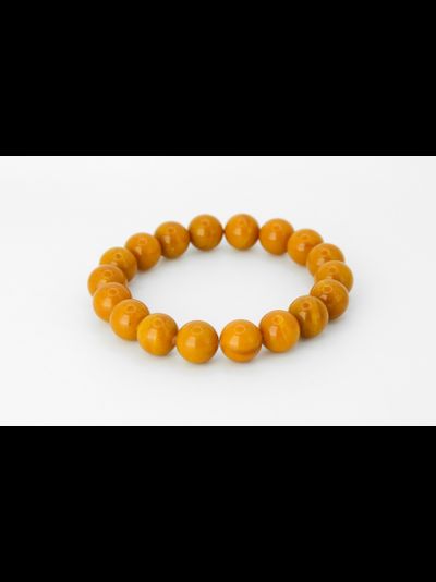 Браслет шары из состаренного янтаря на резинке 10741