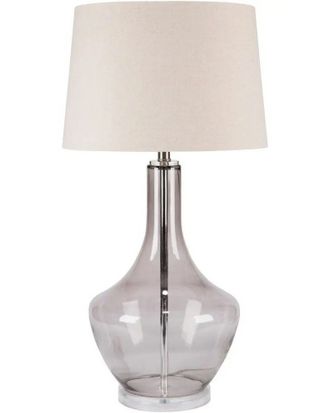 Настольная лампа с основанием из дутого серого стекла и белым абажуром.