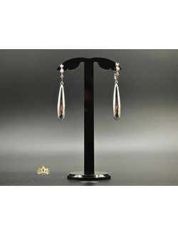 Длинные серьги - капли на кольце с "летящими" кристаллами в серебряном оттенке 6см