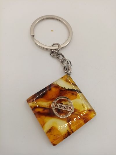 Брелок из натурального янтаря "Nissan"