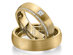 Обручальные кольца из жёлтого золота с дорожкой бриллиантов и одним крупным бриллиантом в женском ко