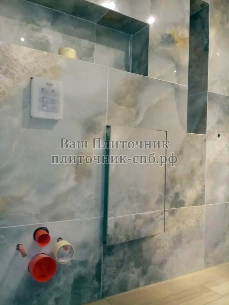 Установка скрытого лючка под плитку в ванной комнате.