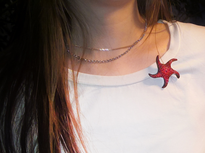 Красивая брошь "Морская звезда Золотых Морей" с родолитом