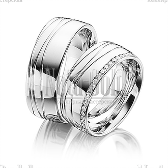 Обручальные кольца из белого золота с дорожкой бриллиантов в женском кольце и волнистым рисунком