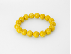 Браслет шары из состаренного янтаря на резинке