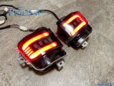 Противотуманки Toyota Land Cruiser 200 бегающие LED черные